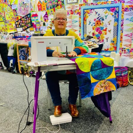 Gai sewing at the Stitches  Craft show in Gold Cost